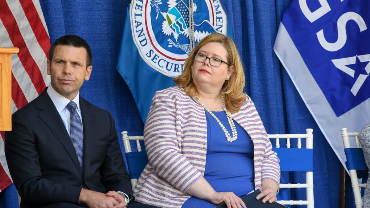 GSA administrator Emily Murphy sits on stage at an event