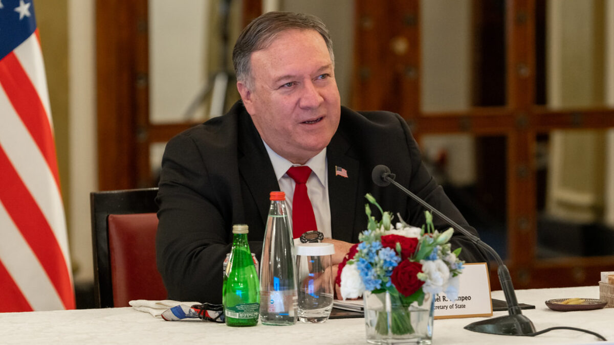 Mike Pompeo speaks while seated at a Madison Dinner table