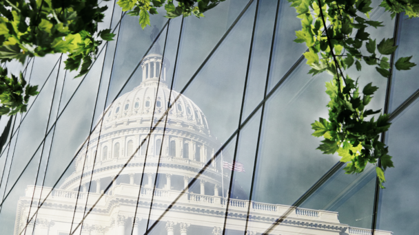 Capitol reflected on a glass building