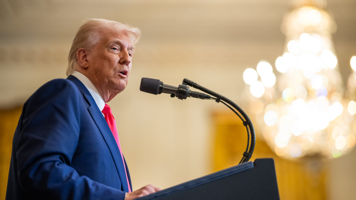 Trump speaks into a mic during an event.