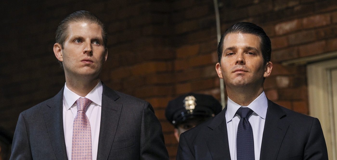 President Trump's sons Eric (left) and Donald Jr., pictured at a 2015 campaign event, are overseeing resorts still underway in places such as the Philippines and Indonesia.