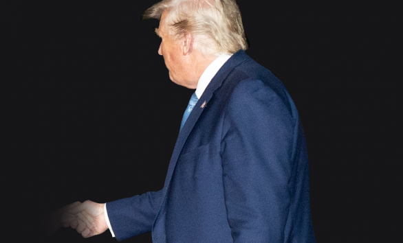 President Trump faces away from the camera, shaking an unknown person's hand with a black background