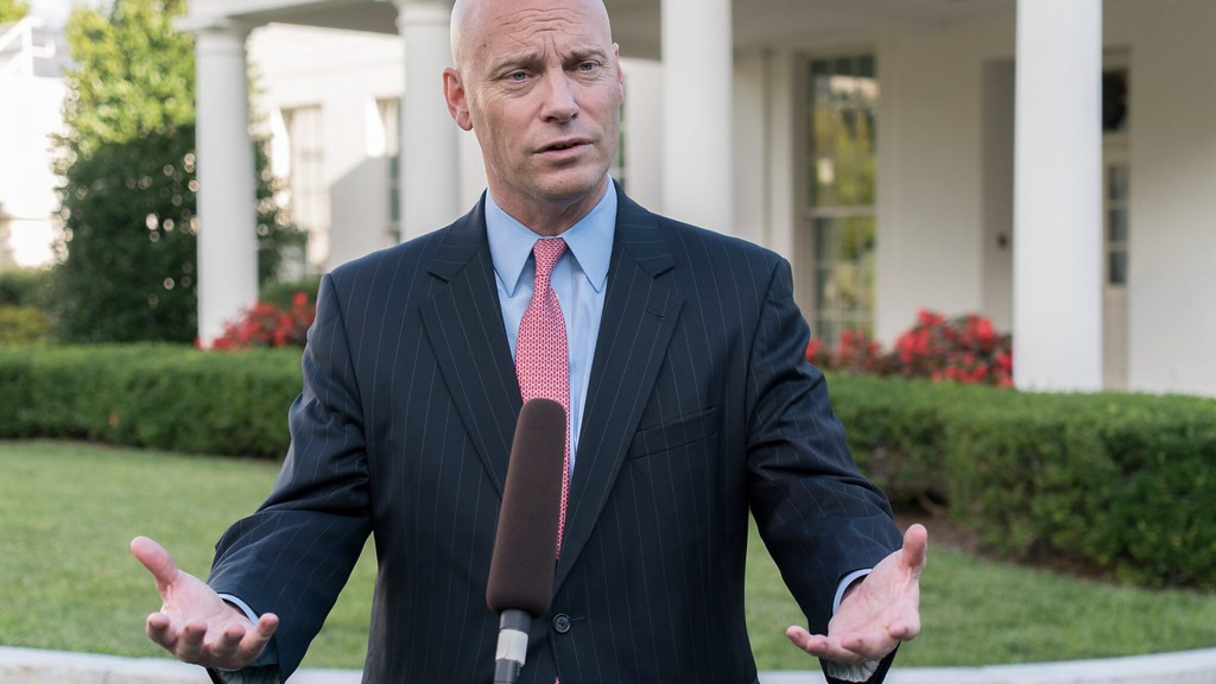 Marc Short speaks emphatically at a podium outside the White House